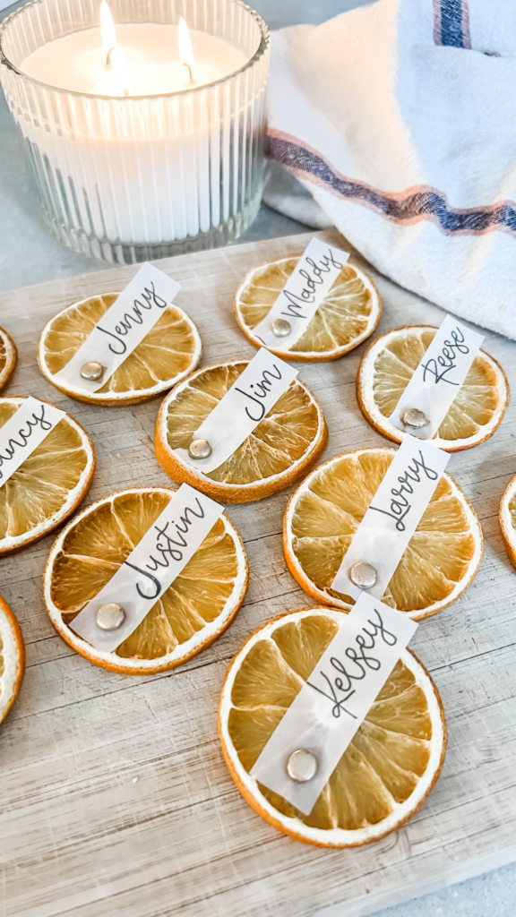A creative and unique name cards for thanksgiving dinner using baked orange slices