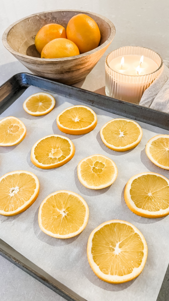 For easy and affordable name card, thinly sliced oranges, pat it dry with a paper towel, and placed onto a baking sheet with parchment paper then bake for four hours.