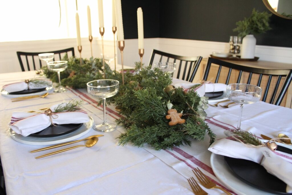 tablescape using twine and greenery for holiday table settings
