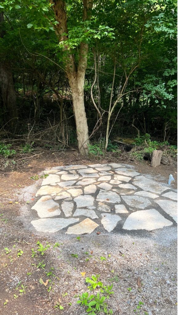 Filling in the gaps between stones with fine sand or gravel