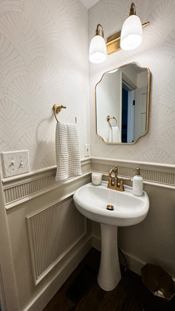 mirror, towel holder and wainscoting, timeless trim