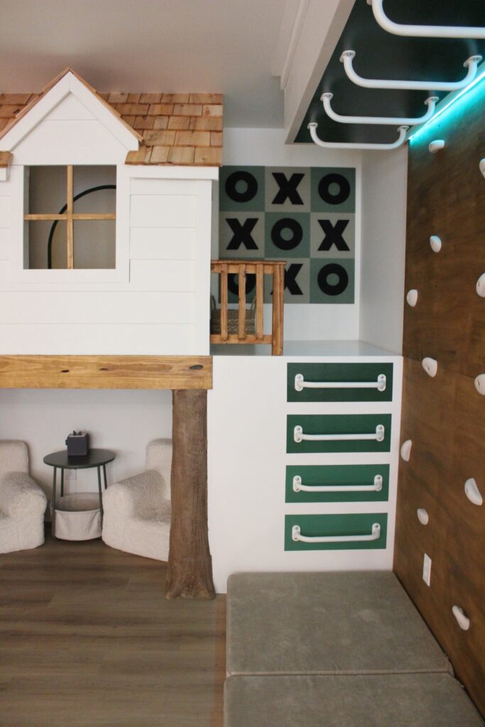 a closer look at the rock climbing wall and monkey bars